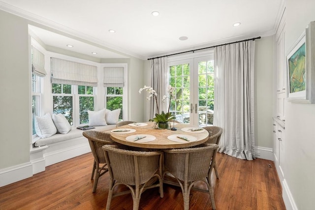 dining area featuring crown molding, french doors, wood finished floors, recessed lighting, and baseboards