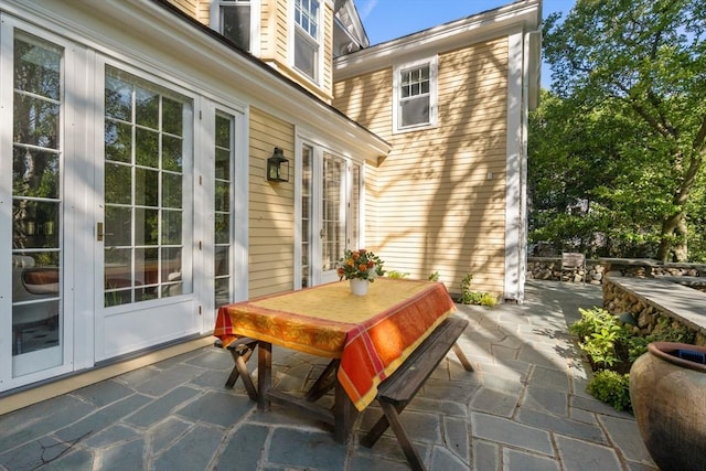 view of patio with outdoor dining area and french doors