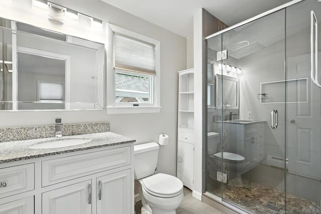 15 Oak Bluff Cir, East Longmeadow, MA 01028 - bathroom with vanity, baseboard heating, and a shower stall