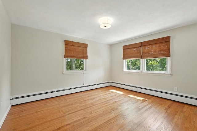 15 Oak Bluff Cir, East Longmeadow, MA 01028 - empty room featuring wood finished floors and a baseboard heating unit