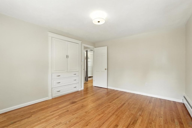 15 Oak Bluff Cir, East Longmeadow, MA 01028 - unfurnished bedroom with light wood-type flooring and a baseboard radiator