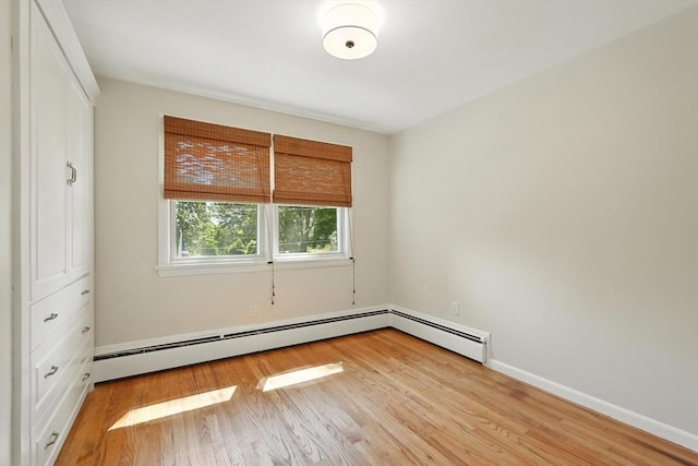 15 Oak Bluff Cir, East Longmeadow, MA 01028 - unfurnished bedroom with wood finished floors and a baseboard heating unit