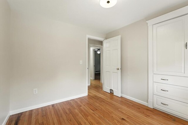 15 Oak Bluff Cir, East Longmeadow, MA 01028 - unfurnished bedroom featuring baseboards and light wood finished floors