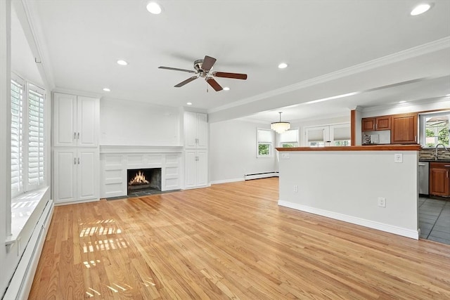 15 Oak Bluff Cir, East Longmeadow, MA 01028 - unfurnished living room with a baseboard heating unit, light wood finished floors, recessed lighting, ceiling fan, and baseboard heating