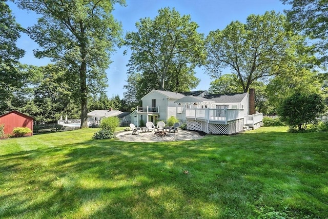 15 Oak Bluff Cir, East Longmeadow, MA 01028 - rear view of house with a patio area, a wooden deck, an outdoor fire pit, and a chimney