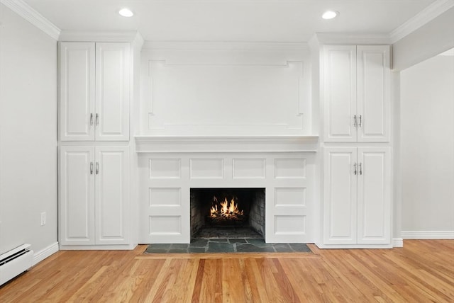 15 Oak Bluff Cir, East Longmeadow, MA 01028 - detailed view of wood finished floors, a baseboard radiator, recessed lighting, ornamental molding, and a fireplace with flush hearth