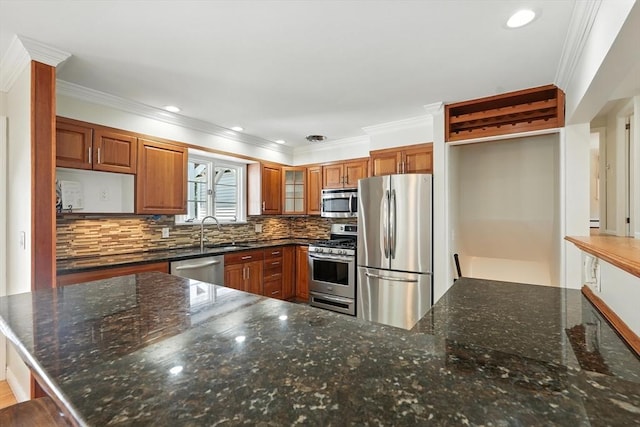 15 Oak Bluff Cir, East Longmeadow, MA 01028 - kitchen featuring appliances with stainless steel finishes, ornamental molding, brown cabinetry, tasteful backsplash, and glass insert cabinets