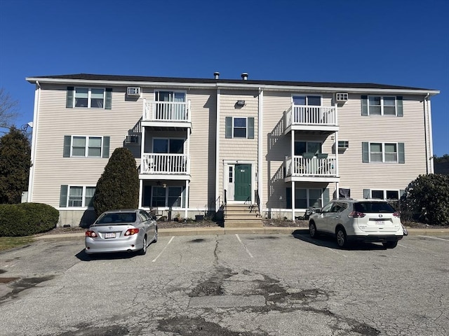 view of property with uncovered parking