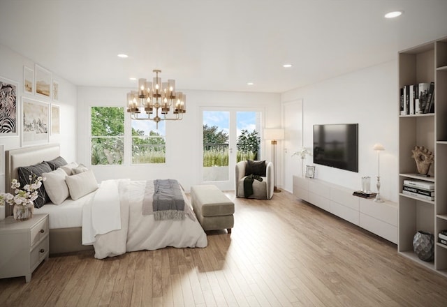 bedroom with light wood-type flooring and a chandelier