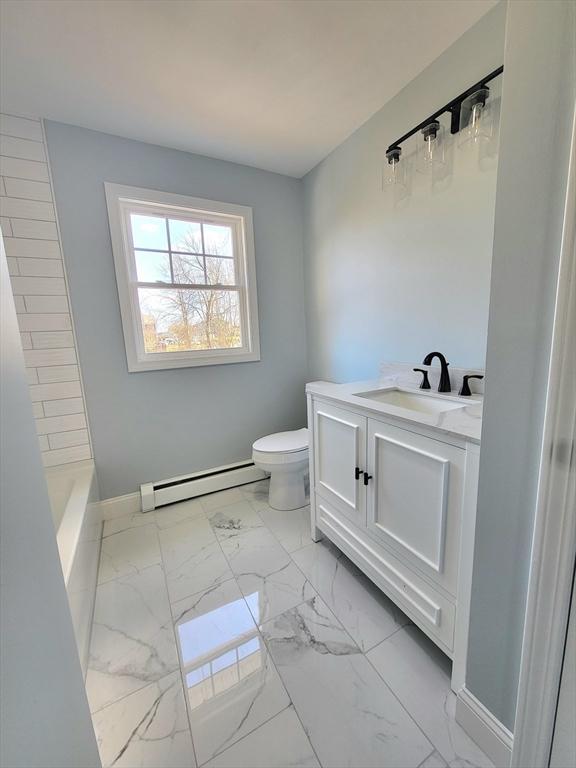 bathroom featuring vanity, a baseboard radiator, and toilet