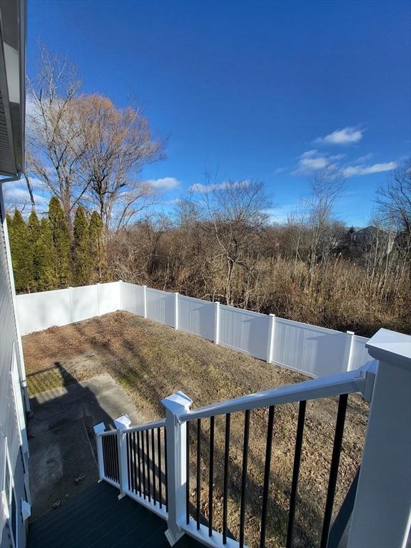 view of yard featuring a wooden deck