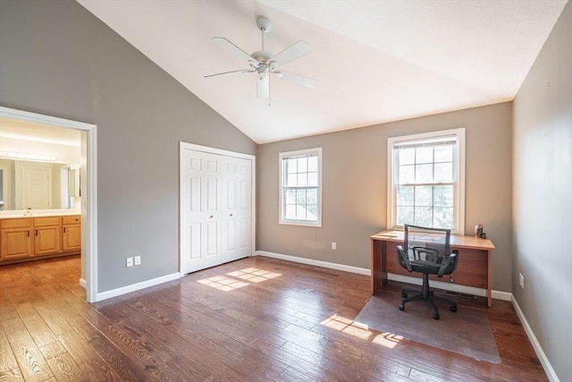 office featuring hardwood / wood-style floors, ceiling fan, baseboards, and high vaulted ceiling