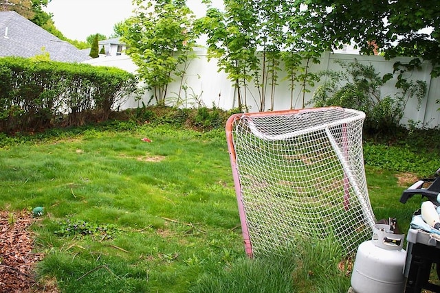 64 Garfield Ave, Woburn, MA 01801 - view of yard with central AC and an area for soccer