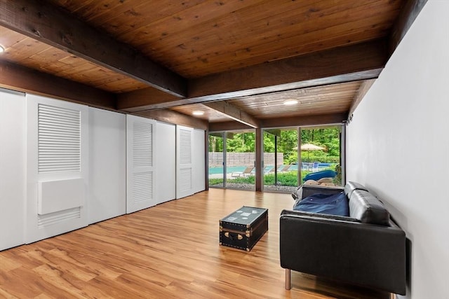 183 Indian Hl, Carlisle, MA 01741 - living area with light wood-style floors and wood ceiling with exposed beams