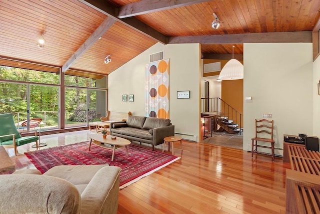 183 Indian Hl, Carlisle, MA 01741 - living area featuring wood ceiling, stairway, hardwood / wood-style flooring, and a baseboard radiator