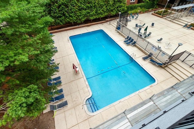 view of swimming pool with a patio