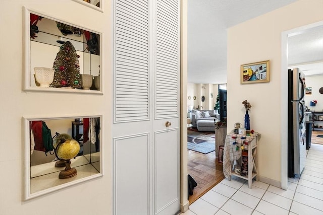 hallway with light tile patterned flooring