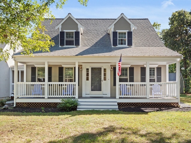 cape cod-style house featuring a front yard and a porch