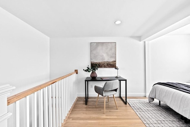 bedroom with recessed lighting, light wood-style flooring, and baseboards