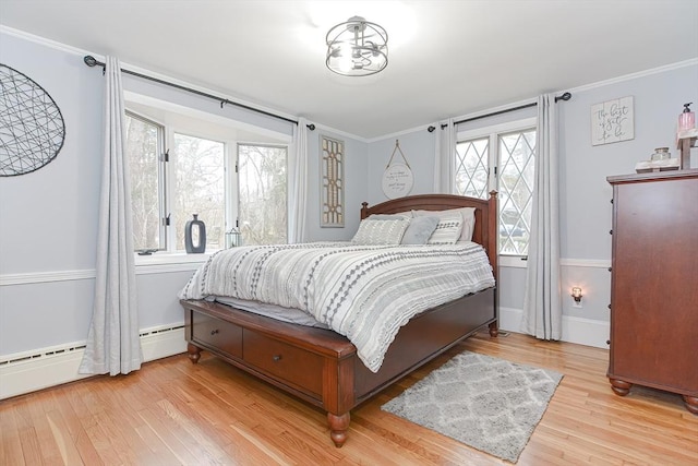 197 N St, Mattapoisett, MA 02739 - bedroom featuring wood finished floors, ornamental molding, a baseboard radiator, and baseboards