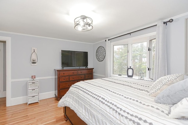 197 N St, Mattapoisett, MA 02739 - bedroom with ornamental molding, light wood finished floors, baseboards, and access to exterior