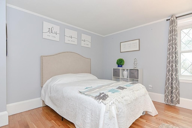 197 N St, Mattapoisett, MA 02739 - bedroom featuring ornamental molding, wood finished floors, multiple windows, and baseboards
