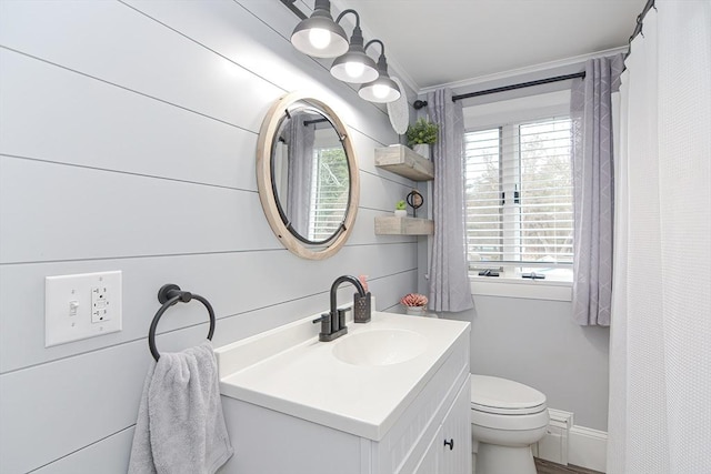 197 N St, Mattapoisett, MA 02739 - bathroom featuring healthy amount of natural light, vanity, toilet, and crown molding