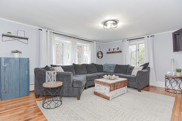 197 N St, Mattapoisett, MA 02739 - living area featuring wood finished floors, ornamental molding, and baseboard heating
