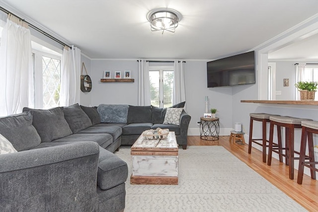 197 N St, Mattapoisett, MA 02739 - living room featuring wood finished floors, ornamental molding, and baseboards