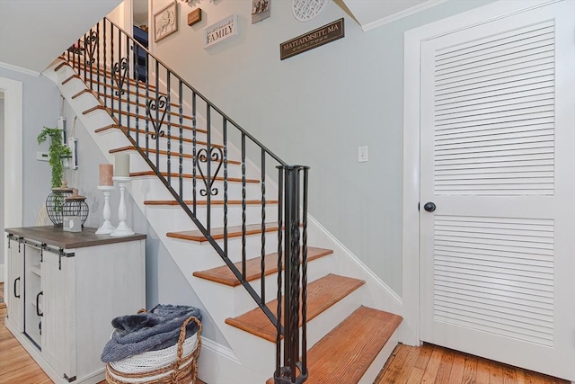 197 N St, Mattapoisett, MA 02739 - staircase featuring wood finished floors, ornamental molding, and baseboards