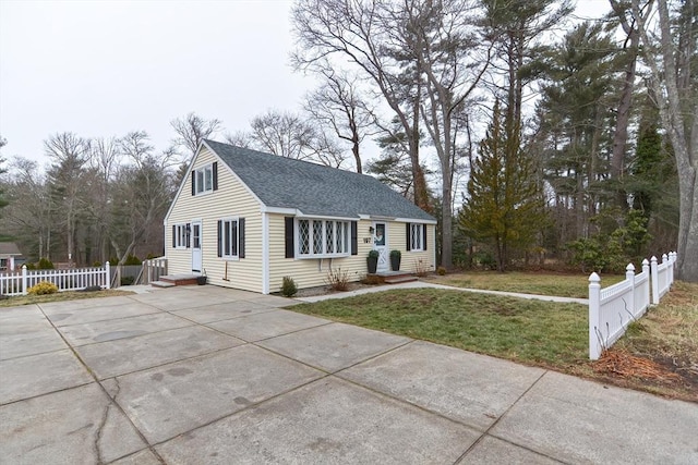 197 N St, Mattapoisett, MA 02739 - view of front of house with a shingled roof and driveway
