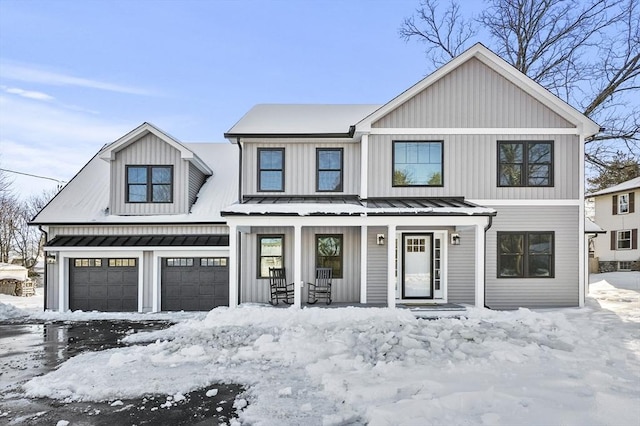 modern inspired farmhouse with a standing seam roof, metal roof, and board and batten siding