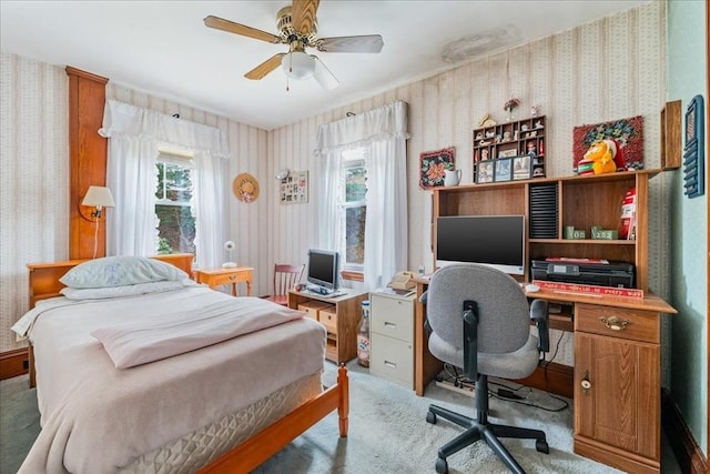 carpeted bedroom featuring ceiling fan