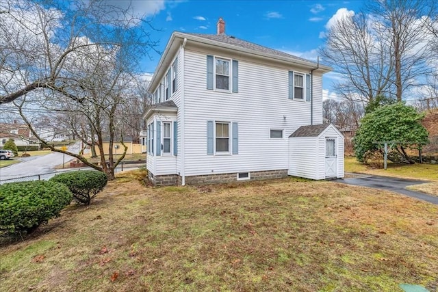 rear view of property featuring a yard