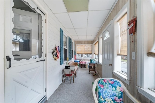 sunroom / solarium featuring a paneled ceiling