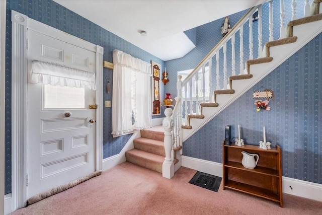 entryway featuring carpet floors