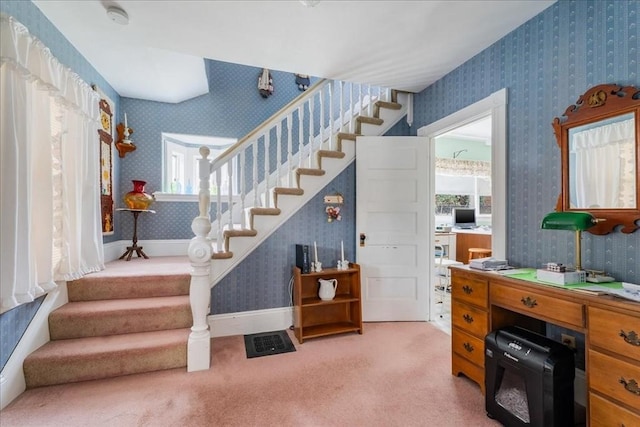 stairs featuring carpet flooring