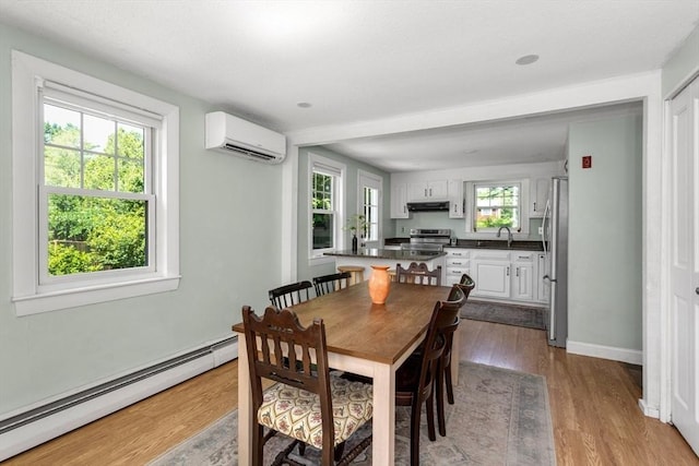 8 May St, Sharon, MA 02067 - dining space with a wall mounted AC, a baseboard radiator, and wood finished floors