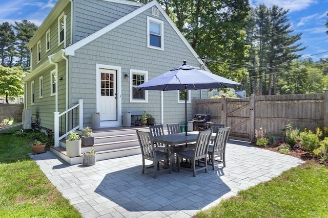 8 May St, Sharon, MA 02067 - back of house with a patio area, a gate, and outdoor dining space