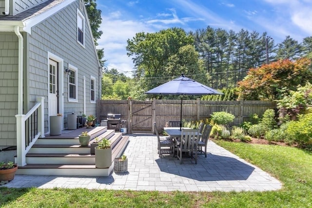8 May St, Sharon, MA 02067 - fenced backyard with a gate, a patio area, area for grilling, and outdoor dining area