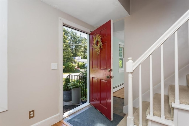 8 May St, Sharon, MA 02067 - entryway with a baseboard heating unit, stairway, healthy amount of natural light, and wood finished floors