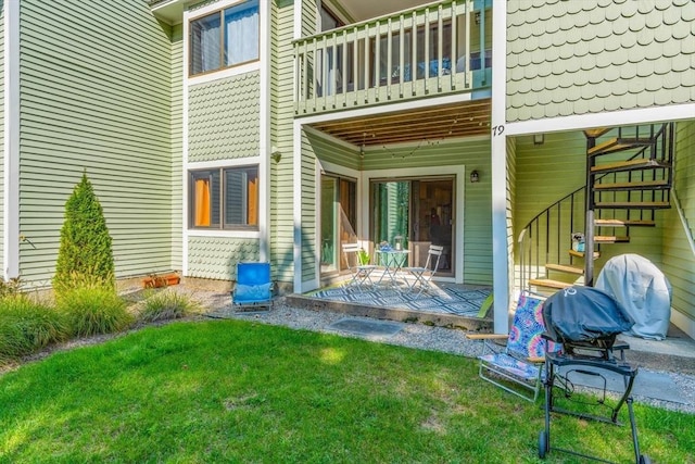 79 Chilton Ln Unit 79, Brewster, MA 02631 - back of property with a patio area, a lawn, and stairs