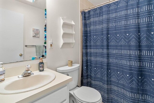 79 Chilton Ln Unit 79, Brewster, MA 02631 - full bathroom featuring toilet, vanity, and a shower with shower curtain