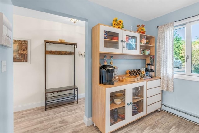 79 Chilton Ln Unit 79, Brewster, MA 02631 - bar featuring a dry bar, light wood finished floors, a baseboard heating unit, and baseboards