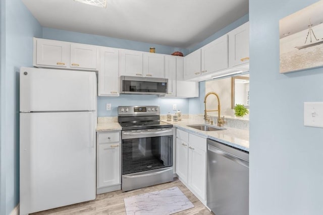79 Chilton Ln Unit 79, Brewster, MA 02631 - kitchen with a sink, white cabinetry, and stainless steel appliances