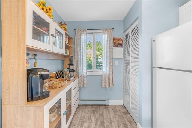 79 Chilton Ln Unit 79, Brewster, MA 02631 - interior space featuring wood finished floors, a baseboard heating unit, and baseboards