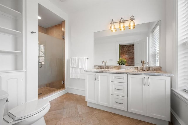 bathroom with walk in shower, vanity, and toilet