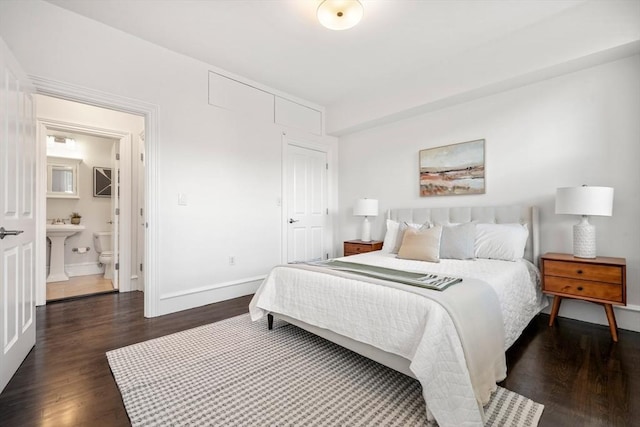 bedroom with dark wood-type flooring