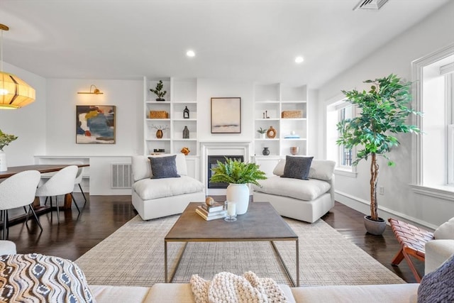 living room featuring dark hardwood / wood-style floors