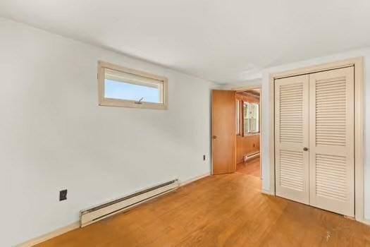 10 Sandpiper Ter, Wareham, MA 02571 - unfurnished bedroom with a baseboard heating unit, a closet, and wood finished floors